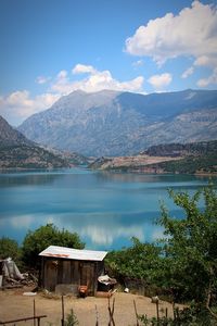 Scenic view of lake and mountains against sky