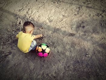 High angle view of man playing with toy