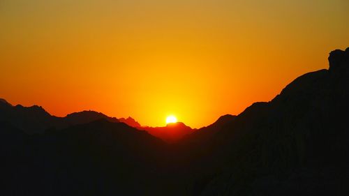 Scenic view of mountains at sunset