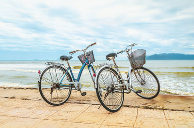 Seascape with two old bicycles