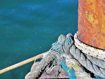 High angle view of rope tied on boat