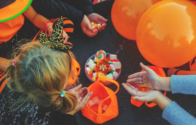 High angle view of girl playing with balloons