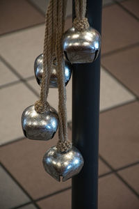 Close-up of rope tied on metal floor
