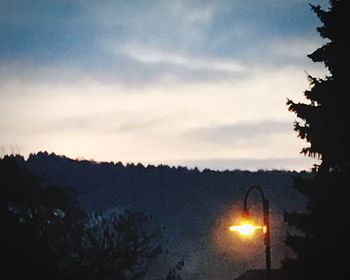 Silhouette of trees against sky at sunset