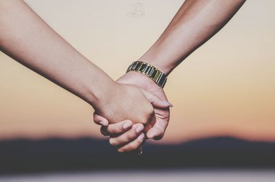 Cropped hand of woman holding hands