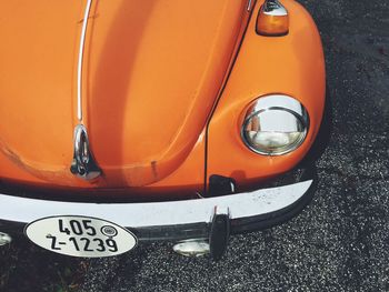 Close-up of car on road