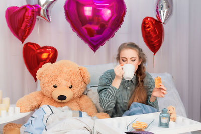 Young woman with toy toys