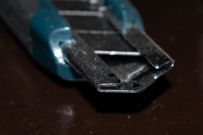 Close-up of rusty metal on table