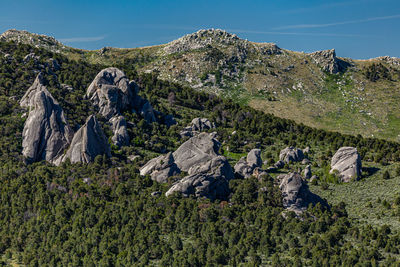 Rocks on mountain against sky