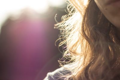 Cropped image of young woman with brown hair