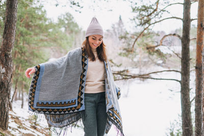 Portrait of smiling woman in snow