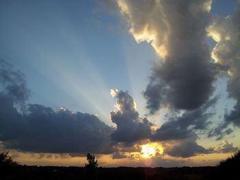 Scenic view of landscape against cloudy sky