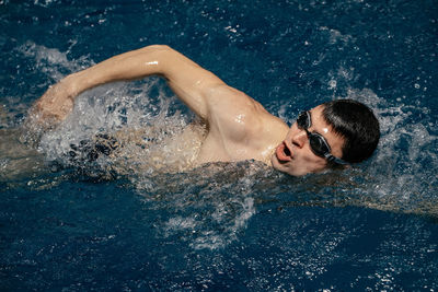 High angle view of man swimming in pool