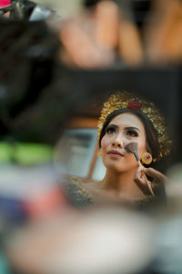 Close-up portrait of young woman in car