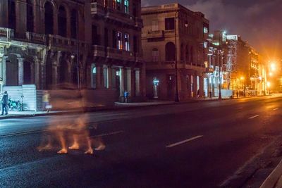 View of buildings in city at night