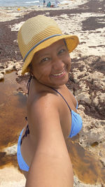 Portrait of smiling woman on beach