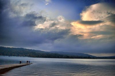 Scenic view of mountains against cloudy sky