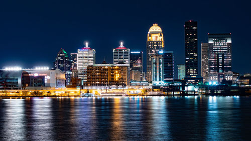 Illuminated buildings in city at night