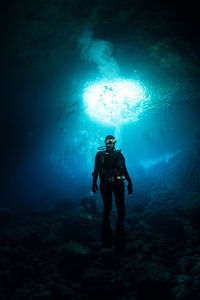 Woman scuba diving in sea