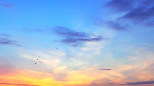 Low angle view of cloudy sky at dusk