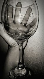 Close-up of man holding wineglass