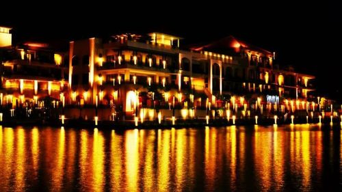 Illuminated buildings in city at night