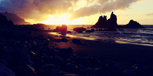 Scenic view of sea against sky at sunset