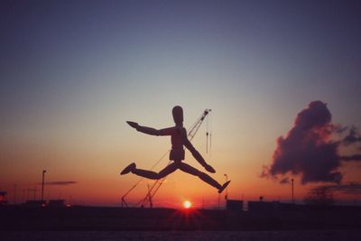 Silhouette of people at sunset