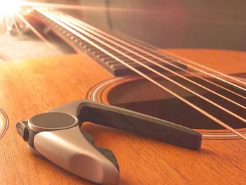 Close-up of guitar on table