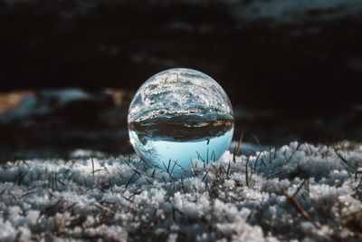 Close-up of crystal ball on field