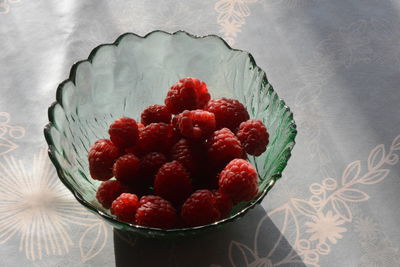 High angle view of strawberries in bowl on table