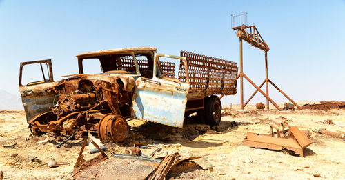 Rusty metallic structure against sky