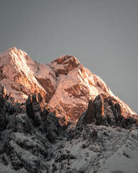 Scenic view of snowcapped mountains against clear sky