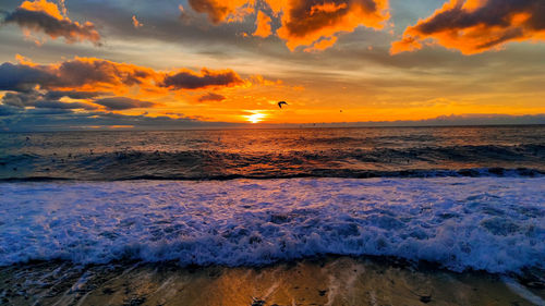 Scenic view of sea against sky during sunset