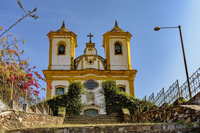 Low angle view of ornate building against sky