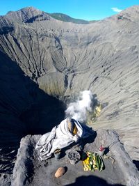 Man with umbrella on mountain