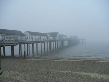 Pier over sea against sky