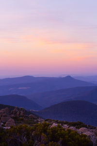 Scenic view of mountains against sky during sunset