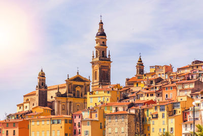 View of buildings in city against sky