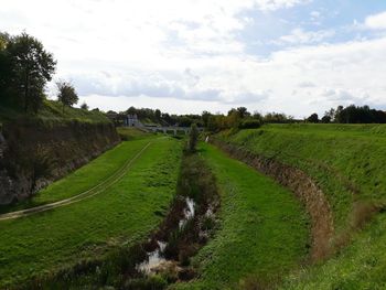 Scenic view of agricultural field against sky