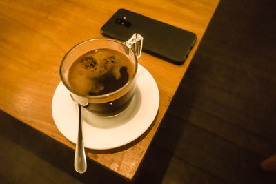 High angle view of coffee cup on table