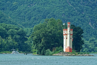 Scenic view of sea against buildings