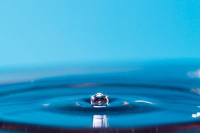 Close-up of water against blue sky