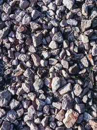 High angle view of stones on field