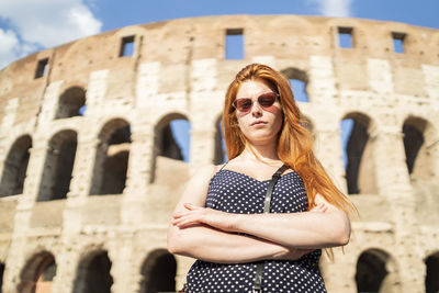 Serious traveler near old building