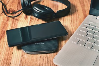 High angle view of laptop and headphones on table