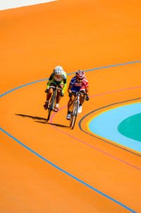 High angle view of people riding bicycle