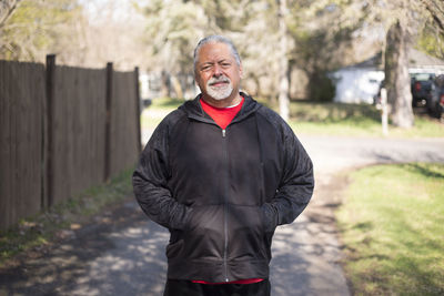 Portrait of smiling man standing outdoors