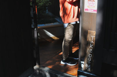 Low section of woman standing on floor