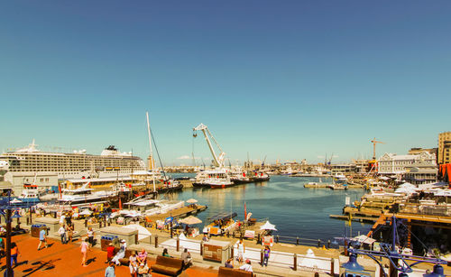 Boats moored at harbor